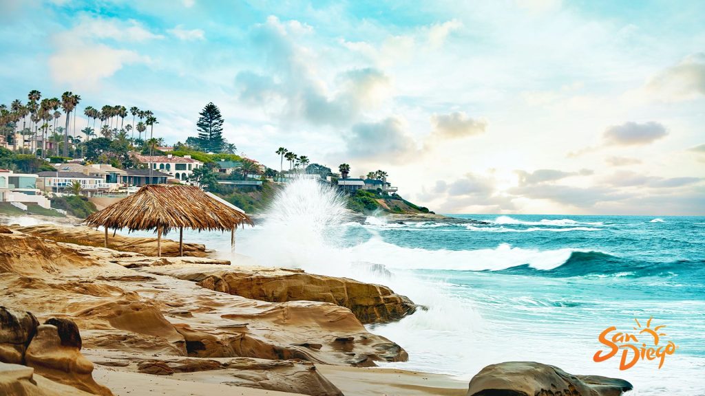 A photo of the san diego coast with waves crashing into rocks