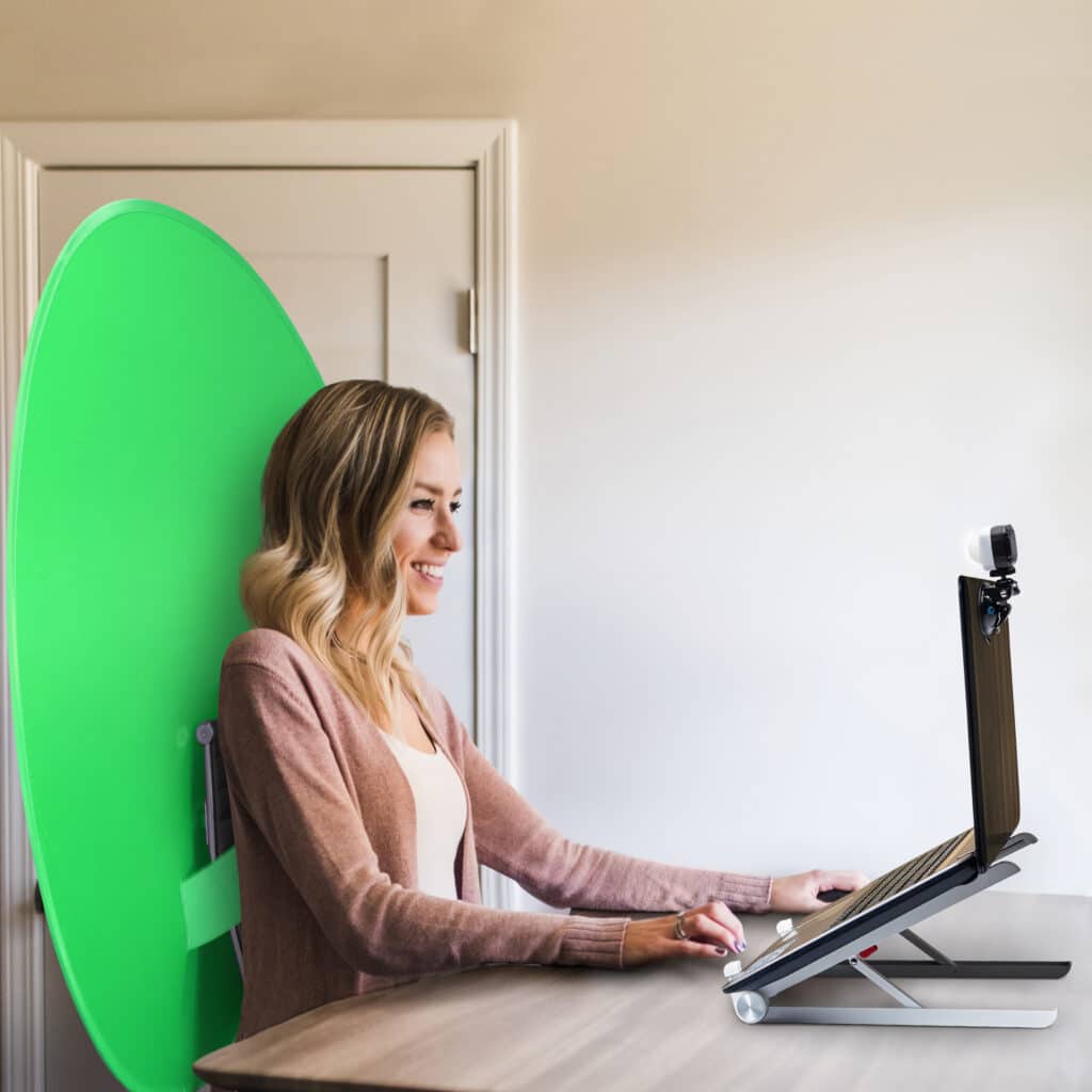 Woman working at a desk with the Webaround on the chair.